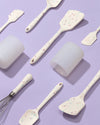 The GIR Sprinkle 4 Piece Mini Tool & Container Set laid out on a grey background.