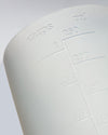 A close up of the GIR Container on a grey background.