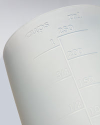 A close up of the GIR Container on a grey background.
