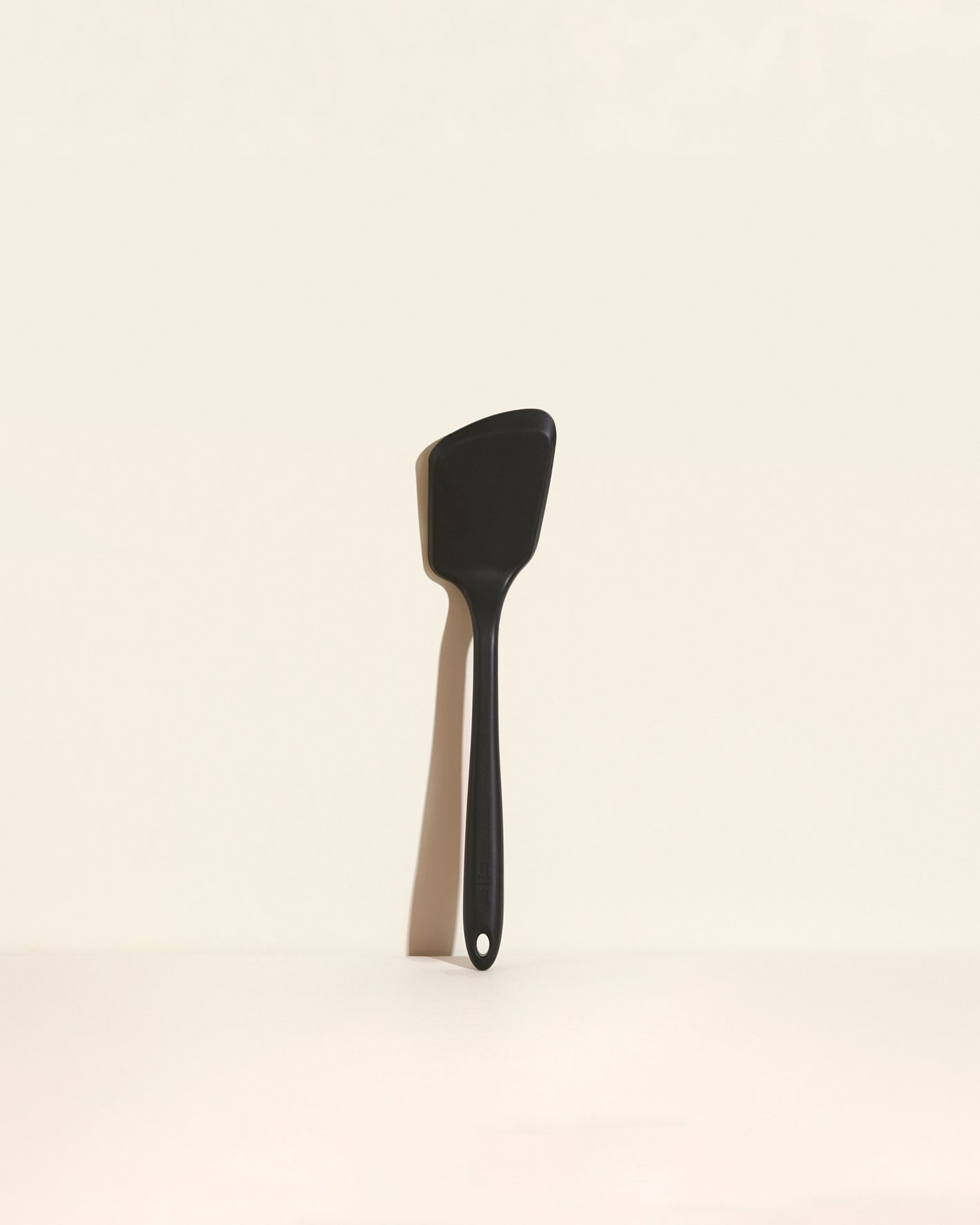 The Black Ultimate Flip on a cream background.