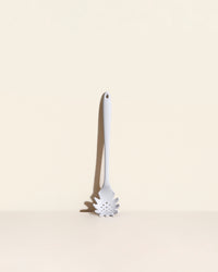 The Ultimate Spaghetti Spoon in Studio on a cream background.