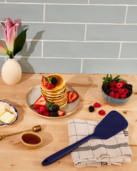 The GIR Ultimate Turner in Navy on counter top with Pancakes and berries next to it. 