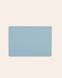 The Slate 12 x 17 Baking mat on a cream background.