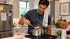 A man cooking hard boiled eggs.