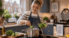A woman putting a broccoli in the pot.