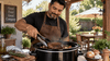 A man cooking a roast beef in slow cooker.