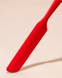 GIR Red Ultimate Spreader on a cream background.