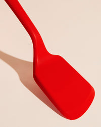 Close-up image of the GIR Flip in Red on a cream background.