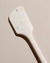Close up of the GIR Sprinkle Spatula on a cream background. 