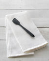 The Black Spatula resting on a Onsen Waffle Hand Towel. 