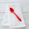 The Red Mini Spoon on a white towel.  