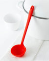 The Red Skinny Ladle on a white towel on a white background. 