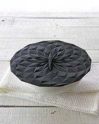 GIR  Black Suction Lid covering a bowl. 