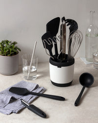 The Black 10 piece Very Best tool set on a marble counter top. 