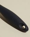 Close-up image of the GIR Black Quad Chopper handle on a cream background.