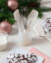 The GIR Sprinkle 4 Piece Mini Tool and Container Set on a Christmas themed table.