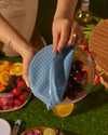A close-up image of the GIR Suction Lid in a picnic setting. 