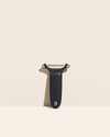  The Y Handle Flat Peeler in Black on a cream background. 