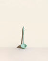 The Mint Skinny Ladle on a cream background. 