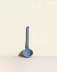 The Slate Ultimate Ladle on a cream background. 