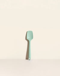 The Mint Ultimate Spoonula on a cream background. 