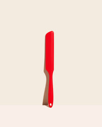 GIR Red Ultimate Spreader on a cream background.