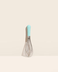 The Sea Foam Ultimate Whisk on a cream background. 