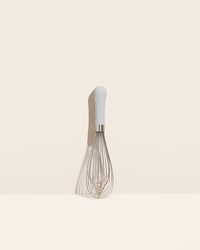 The Studio Ultimate Whisk on a cream background. 