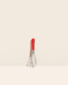 The Red Mini Whisk on a cream background. 