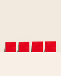 The Red Mini 4 Pack Flex Mats on a cream background. 