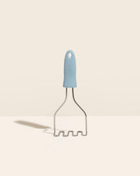 The GIR Slate Wire Masher on a cream background. 
