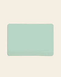 The Mint 12 x 17 Baking mat on a cream background. 