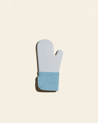 The Slate Oven Mitt on a cream background. 