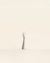 The Sprinkle Mini Spatula on a cream background. 