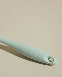 Close-up image of the GIR Mint Quad Chopper handle on a cream background.