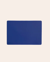 The Standard Quarter Royal Blue Baking Mat on a cream background. 