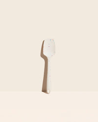 The Sprinkle Ultimate Spoonula on a cream background. 