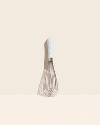 The Barcelona Ultimate Whisk on a cream background. 